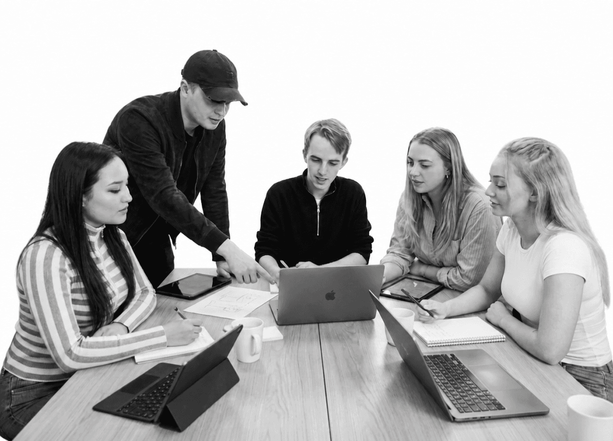 Consultico team working together around a laptop